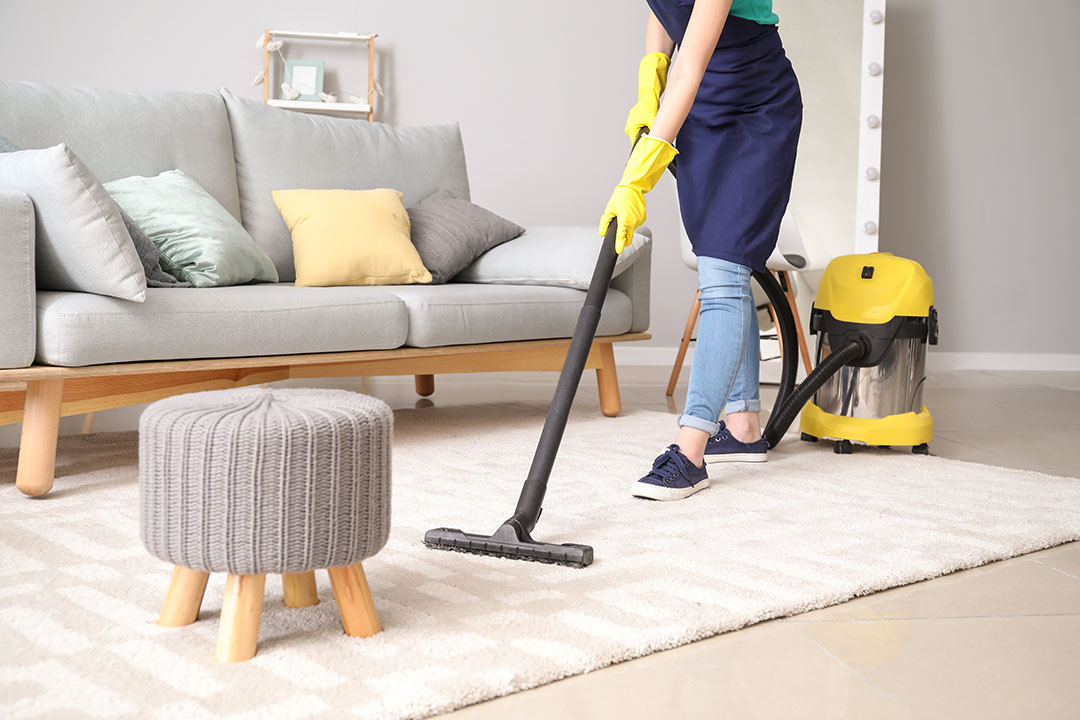 vacuuming a rug